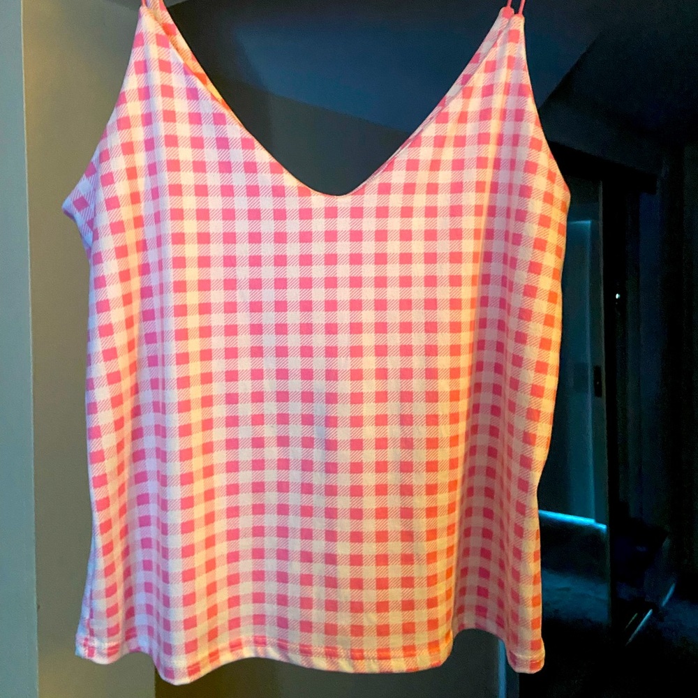 Stretching cute tank pink and white squares. Comfortable